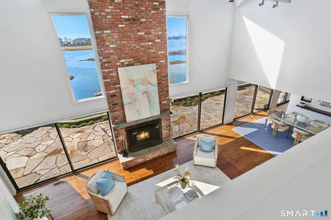 a spacious bedroom with a bed and a large window