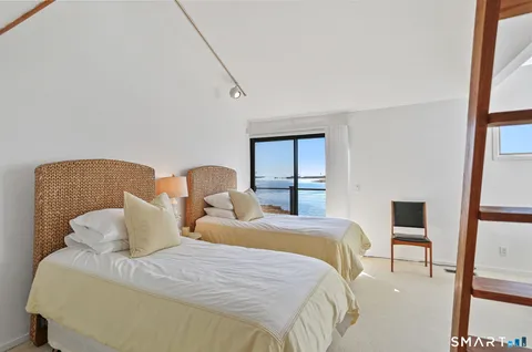 a room with a window wooden floor and garden view
