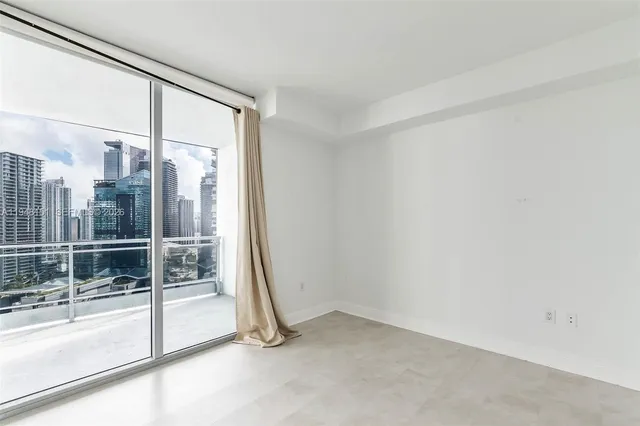 a bathroom with a granite countertop sink toilet a mirror a shower and a sink