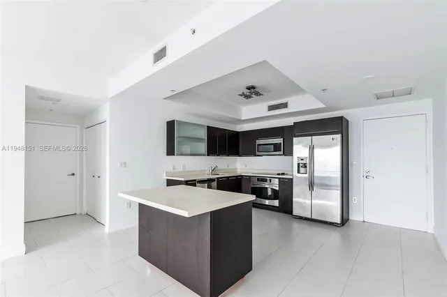 a view of an empty room with glass door