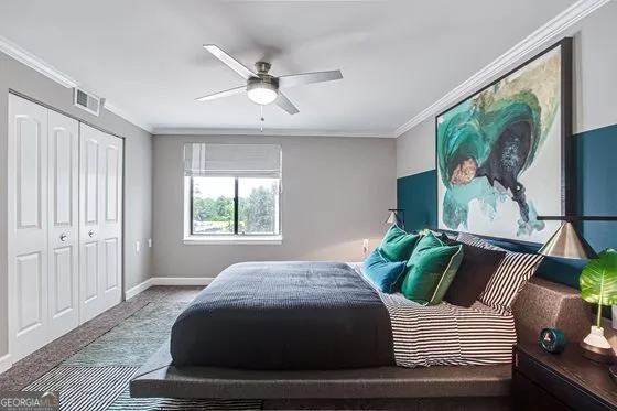 a bedroom with a bed and glass window