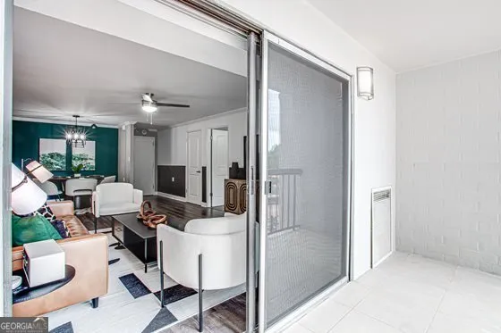 a room with a couch and a view of living room