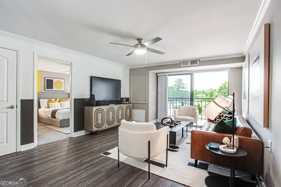 a living room with furniture and a flat screen tv