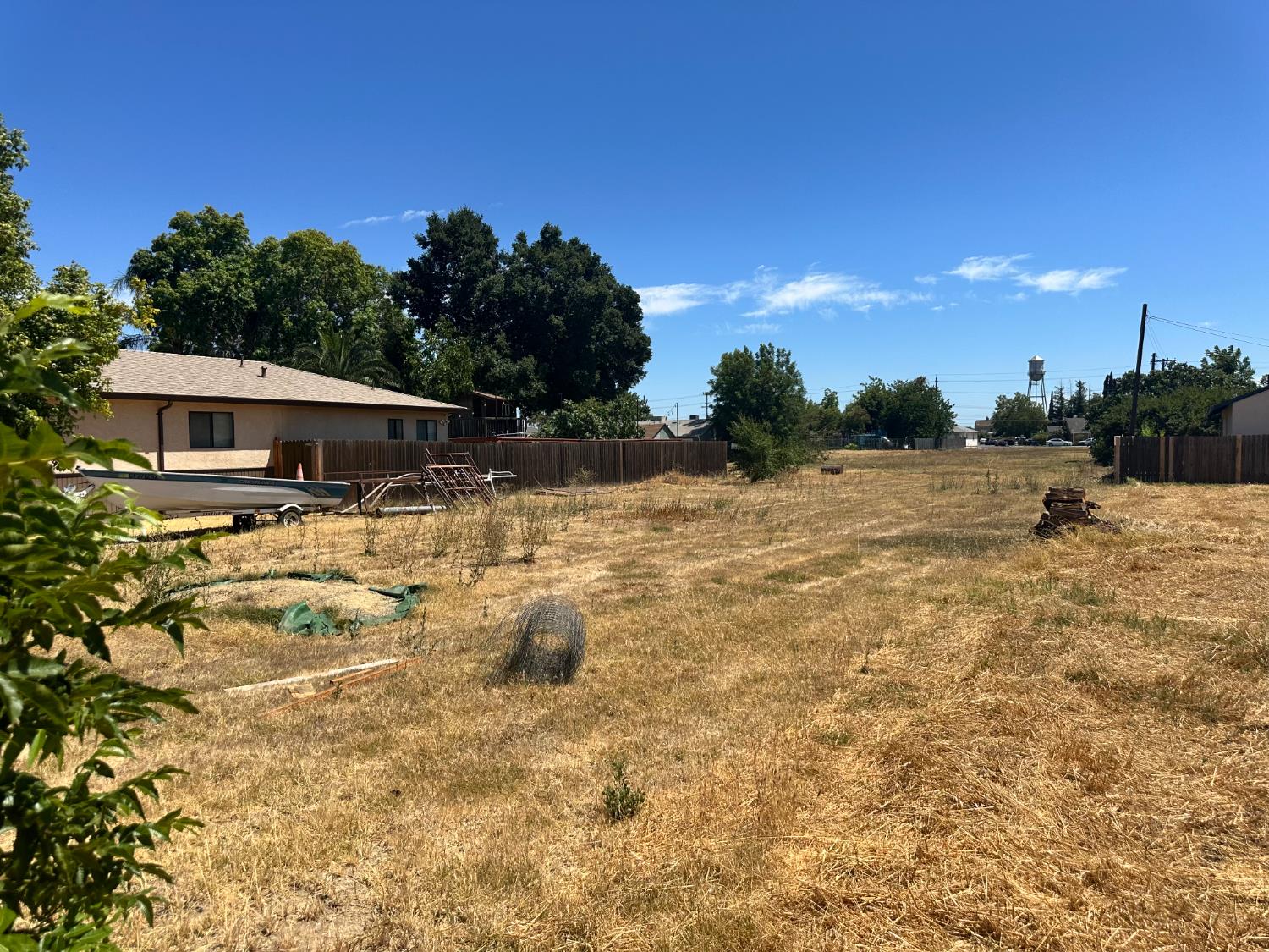 614 Myrtle Street Galt, CA 95632 - Photo 2 of 6 a view of yard with swimming pool and trees