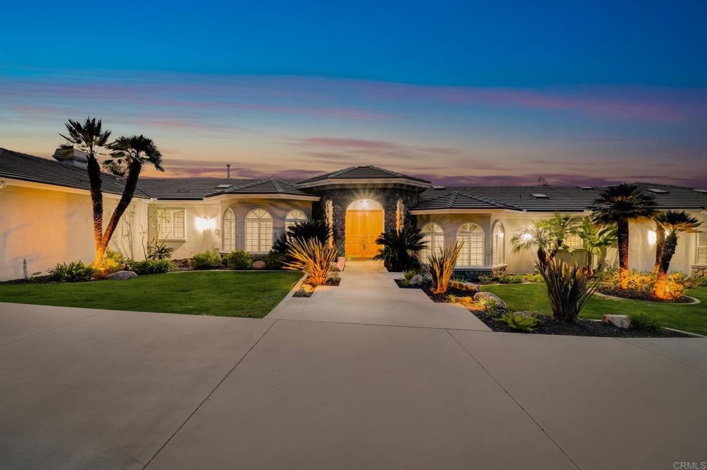 2801 Via Asoleado Alpine, CA 91901 - Photo 2 of 74 a view of a patio with table and chairs under an umbrella