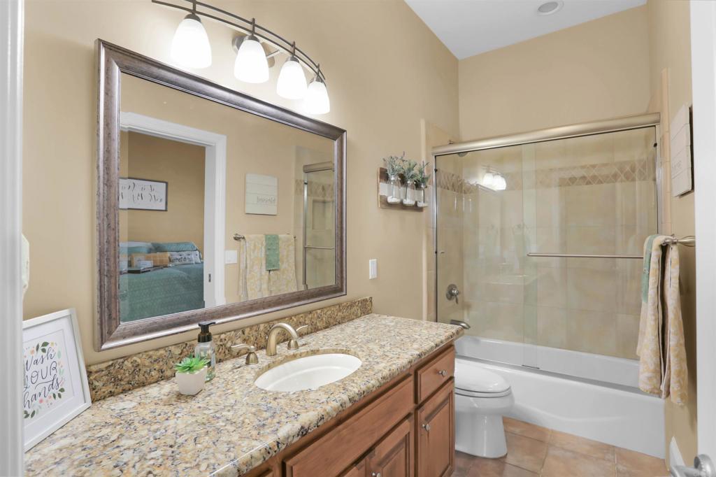 2801 Via Asoleado Alpine, CA 91901 - Photo 29 of 74 a bathroom with a granite countertop sink toilet and shower