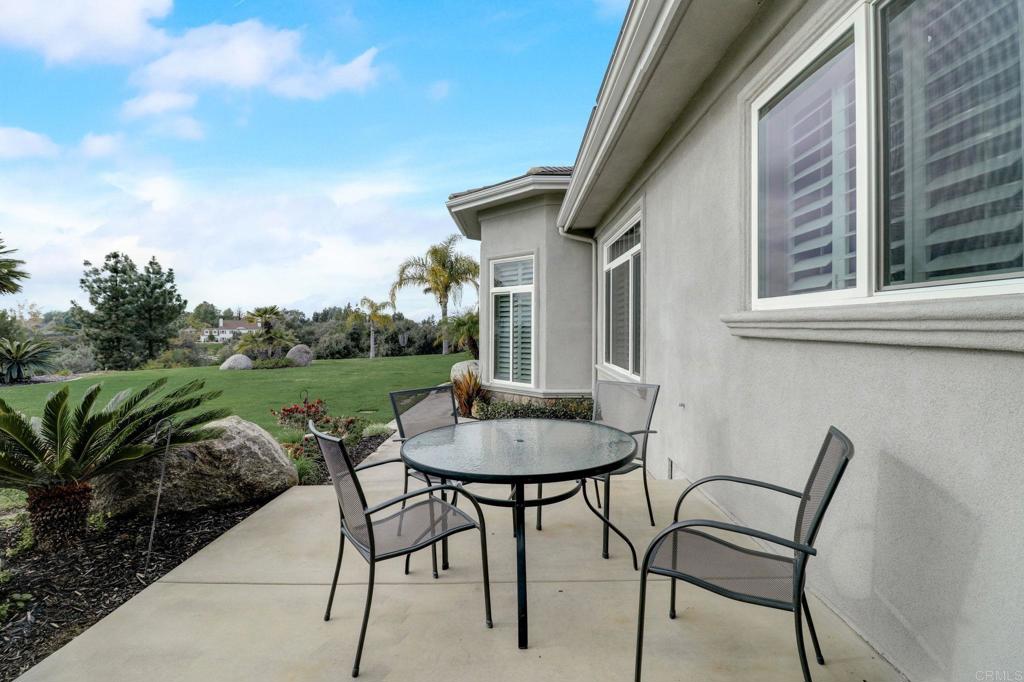 2801 Via Asoleado Alpine, CA 91901 - Photo 46 of 74 a balcony with table and chairs with plants and lake view