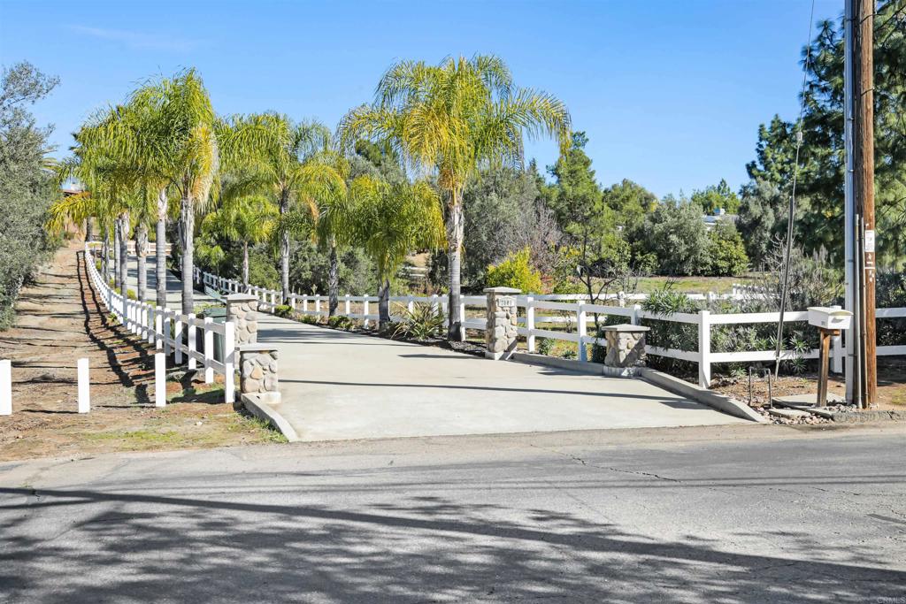 2801 Via Asoleado Alpine, CA 91901 - Photo 53 of 74 a view of a swimming pool with a lawn chairs and palm tree