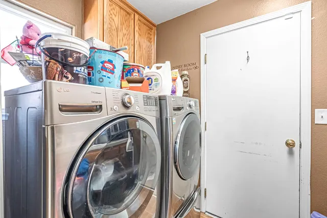 a utility room with dryer and washer