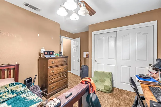 a bedroom with a bed and furniture