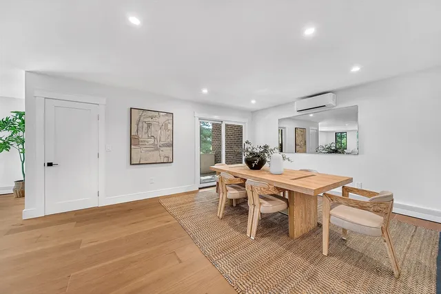 a dining room with a table and chairs