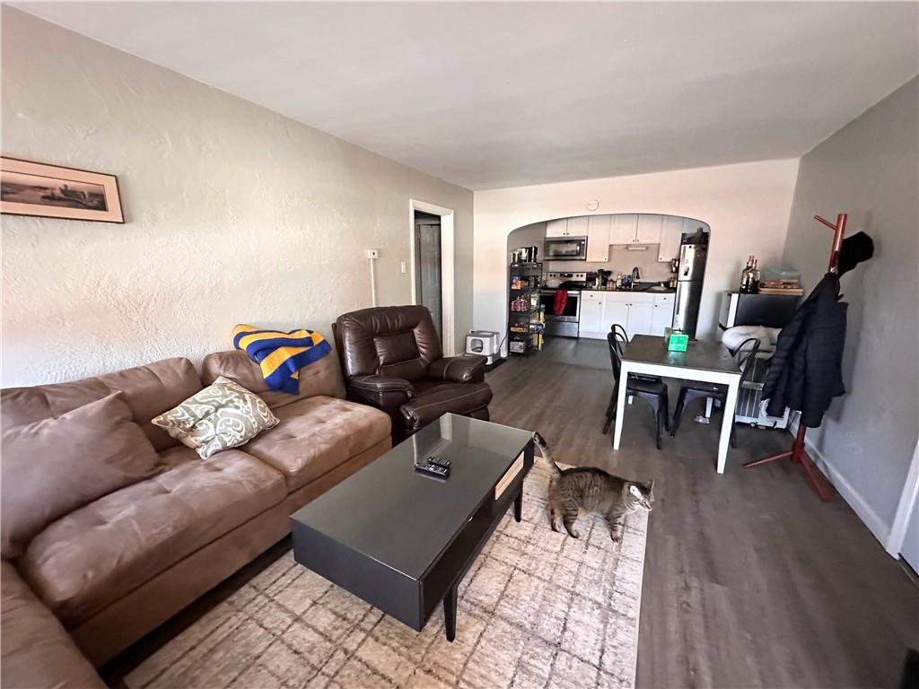 422 Mill Street, Unit D Coraopolis, PA 15108 - Photo 6 of 6 a living room with furniture and wooden floor