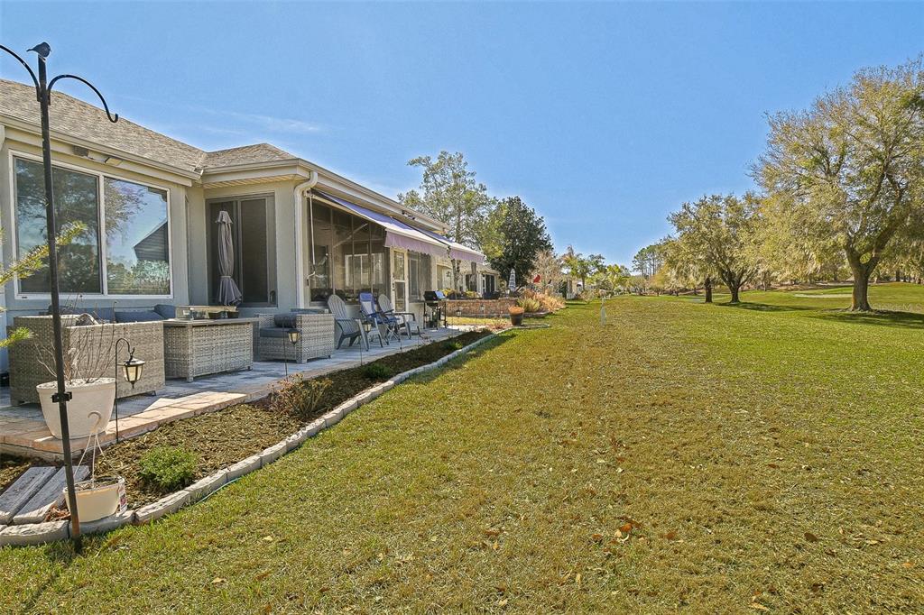 13280 Southeast 92nd Court Road Summerfield, FL 34491 - Photo 43 of 87 a view of a patio with swimming pool