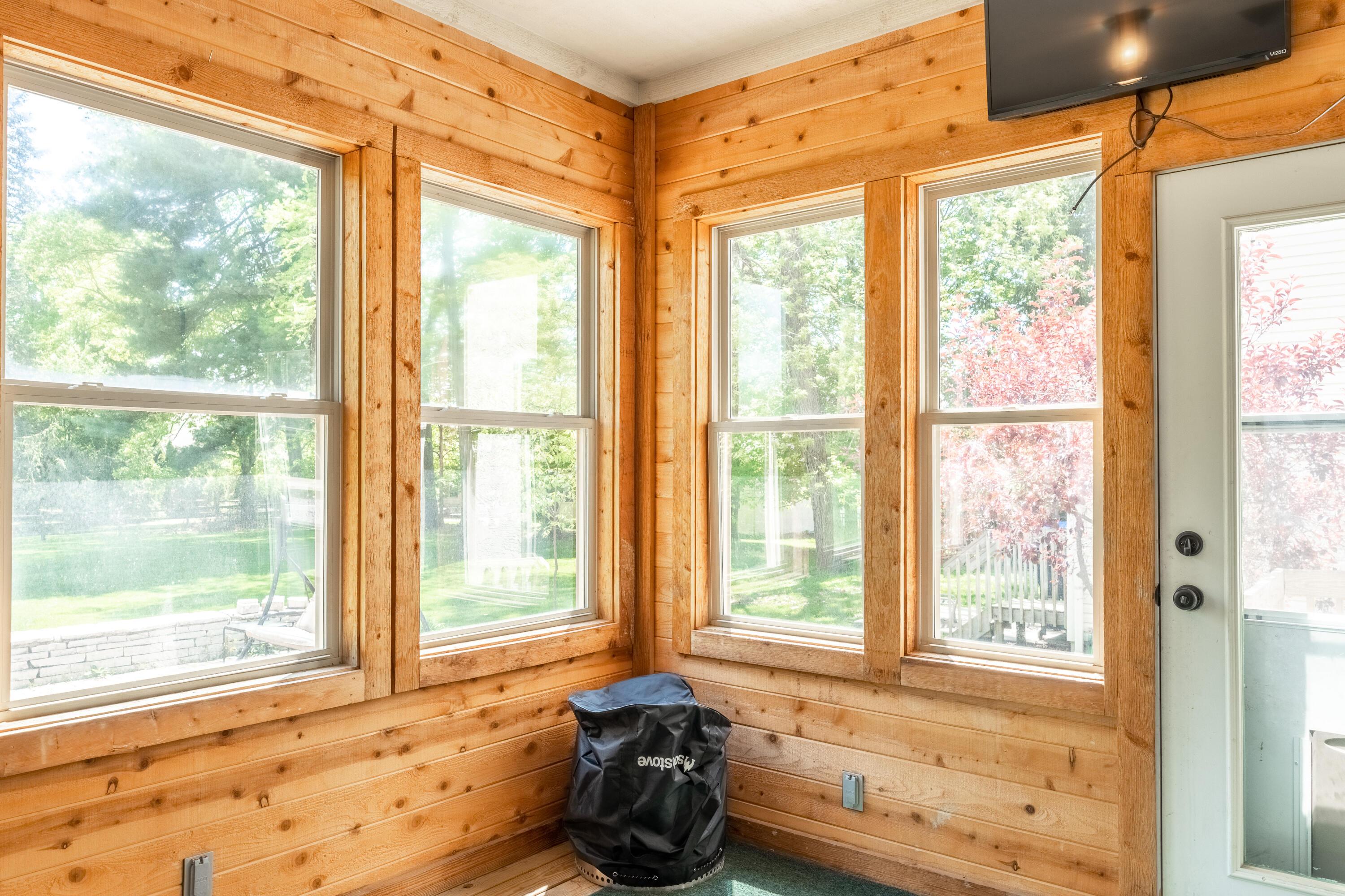 7168 Linworth Road Columbus, OH 43235 - Photo 12 of 34 Cedar plank walls enhance the 3-season room