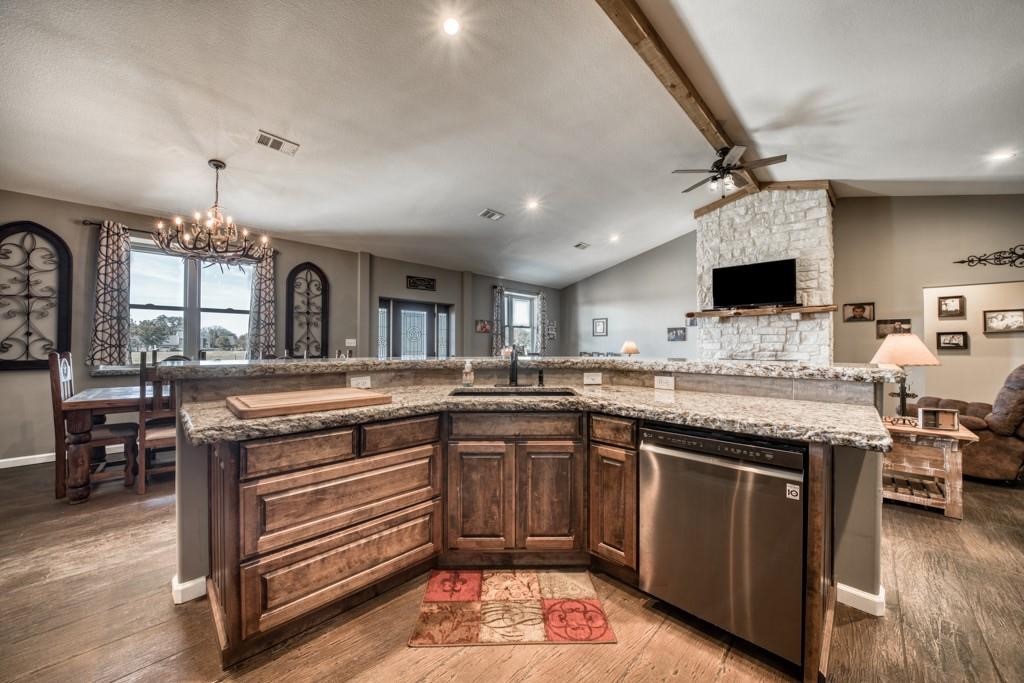 22273 Chapman Road Hempstead, TX 77445 - Photo 13 of 49 a kitchen with a stove sink and cabinets