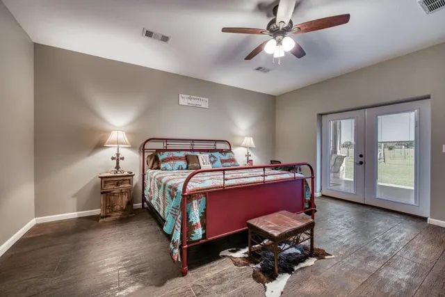 a bedroom with a bed and a curtain