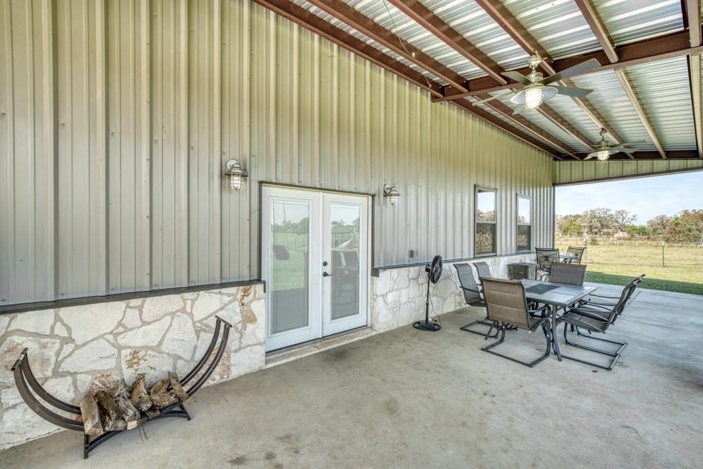22273 Chapman Road Hempstead, TX 77445 - Photo 40 of 49 a living room with furniture and a floor to ceiling window