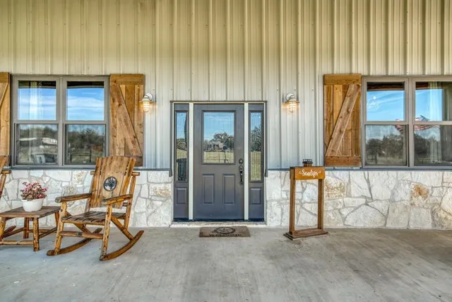 a living room with fireplace furniture and a flat screen tv