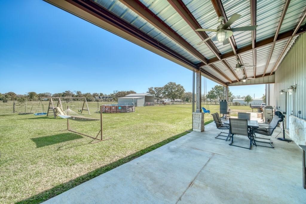 22273 Chapman Road Hempstead, TX 77445 - Photo 42 of 49 a view of a swimming pool with a patio