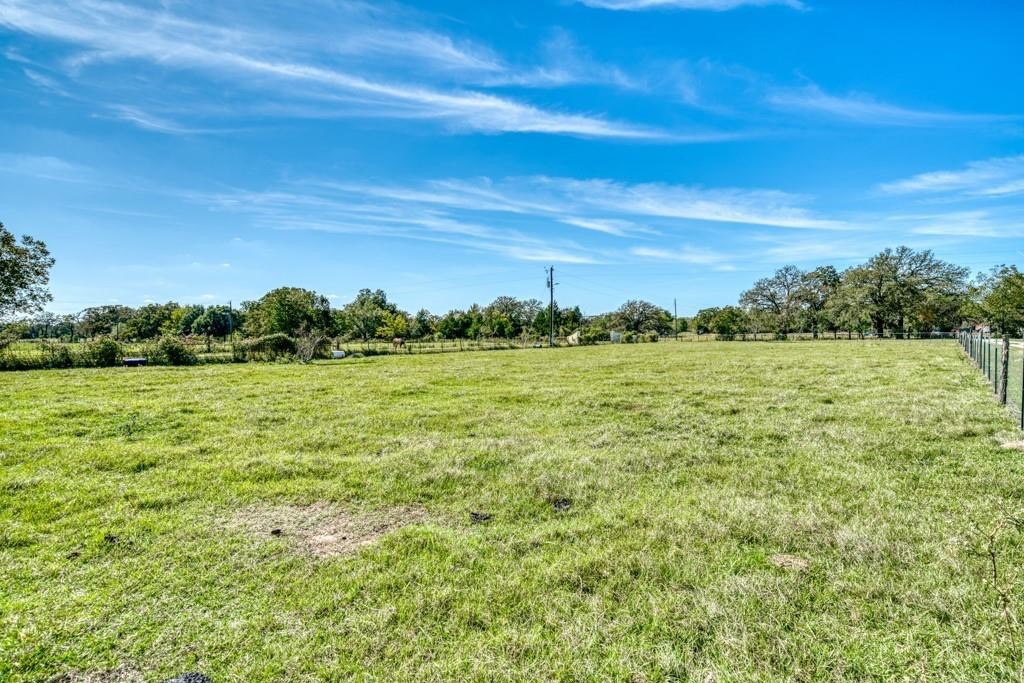 22273 Chapman Road Hempstead, TX 77445 - Photo 49 of 49 a view of a field with an trees in the background