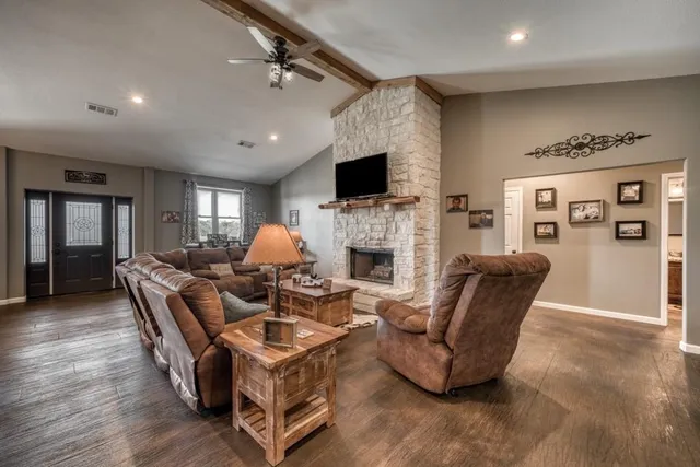 a living room with furniture or couch and a bookshelf