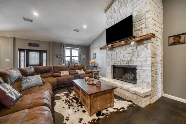 a view of a dining room with furniture and chandelier