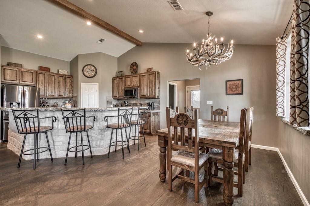 22273 Chapman Road Hempstead, TX 77445 - Photo 9 of 49 a view of a dining room with furniture and chandelier