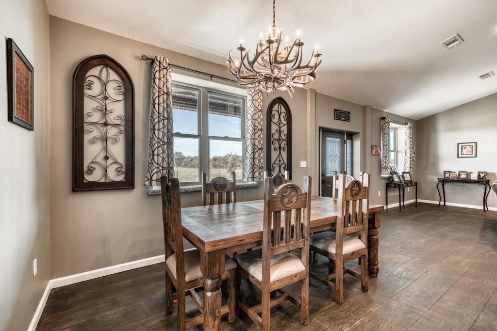 22273 Chapman Road Hempstead, TX 77445 - Photo 10 of 49 a view of a dining room with furniture window and wooden floor