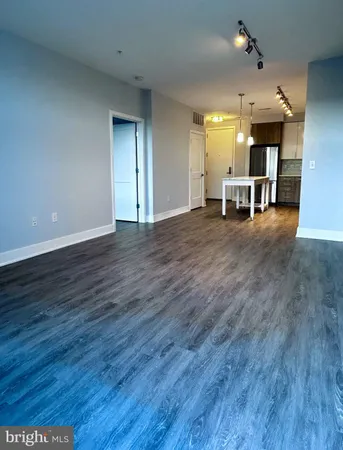 a view of a livingroom with furniture and wooden floor