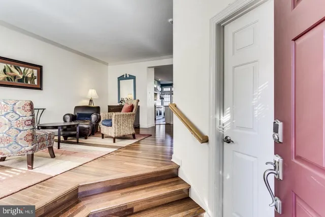 a living room with furniture and a piano