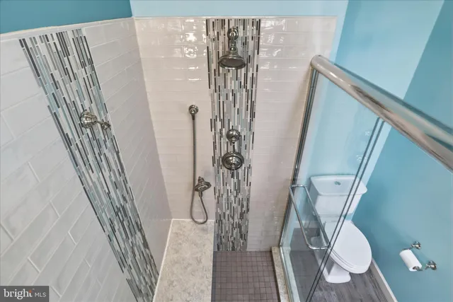 a view of a staircase with white walls