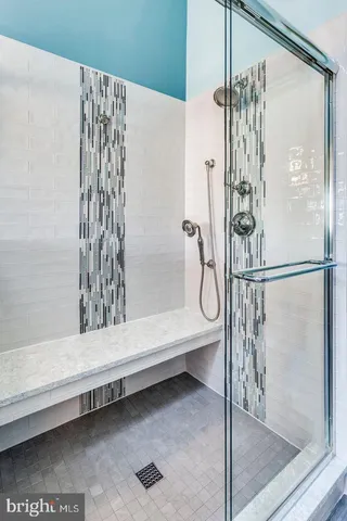 a bathroom with a shower and a bathtub