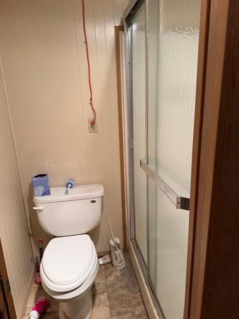 235 Connell Road Vidor, TX 77662 - Photo 13 of 35 a bathroom with a toilet and a shower