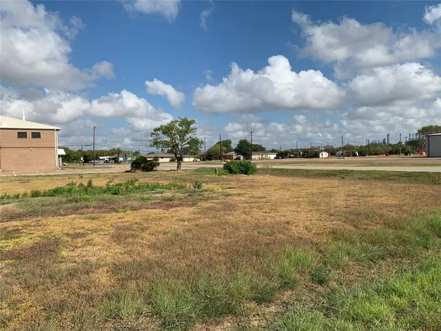 a view of a lake with houses in the back