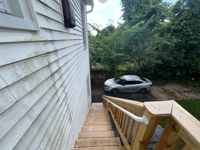 a balcony view with a seating space
