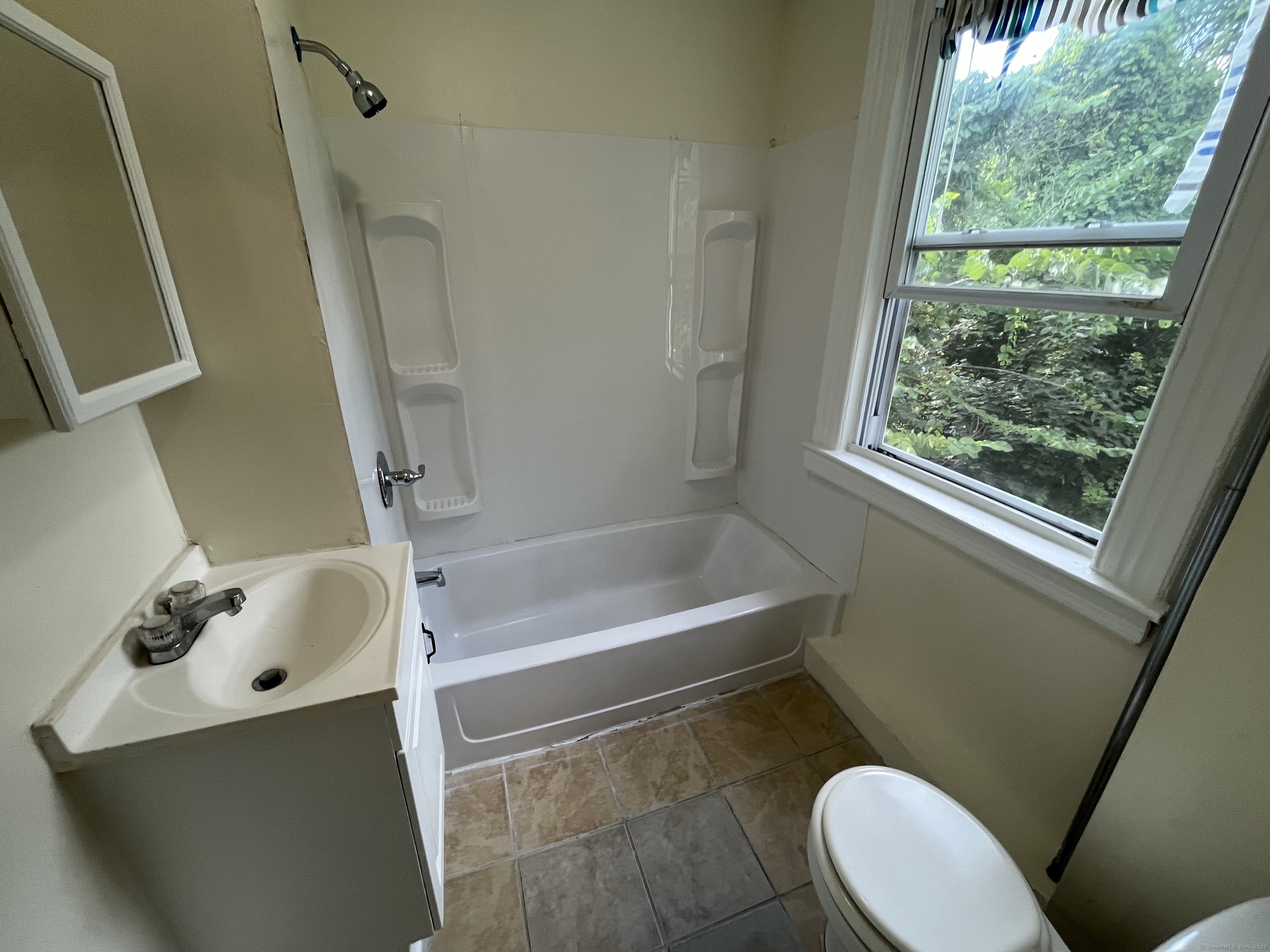 144 Burnham Street, Unit 2 Hartford, CT 06112 - Photo 6 of 11 a bathroom with a sink a toilet and a bathtub