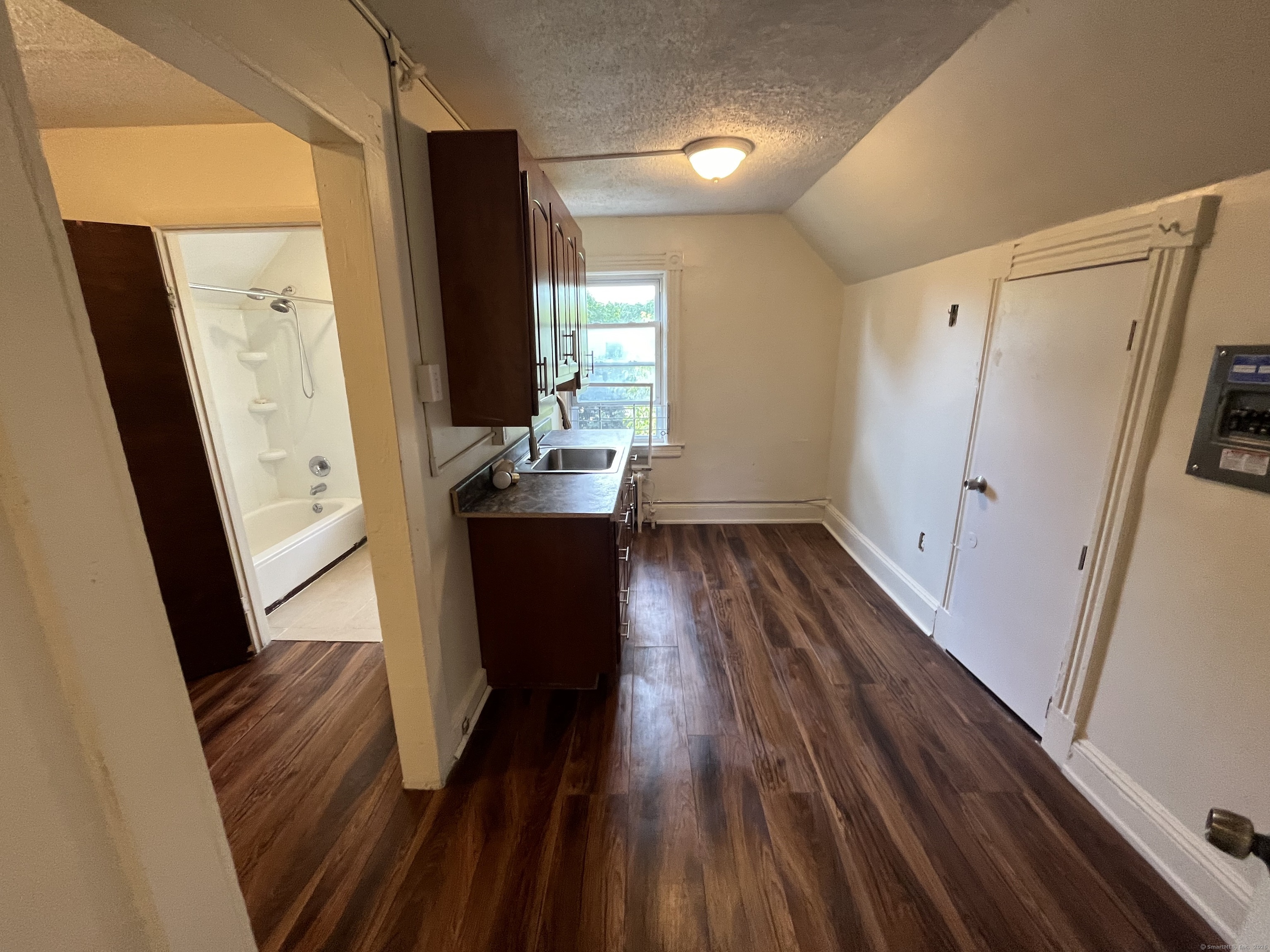 144 Burnham Street, Unit 2 Hartford, CT 06112 - Photo 7 of 11 a view of kitchen with wooden floor and electronic appliances