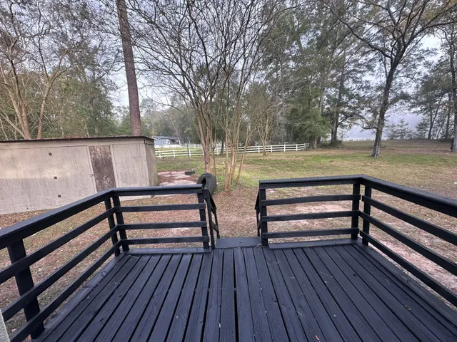 a view of deck with wooden floor and outdoor seating