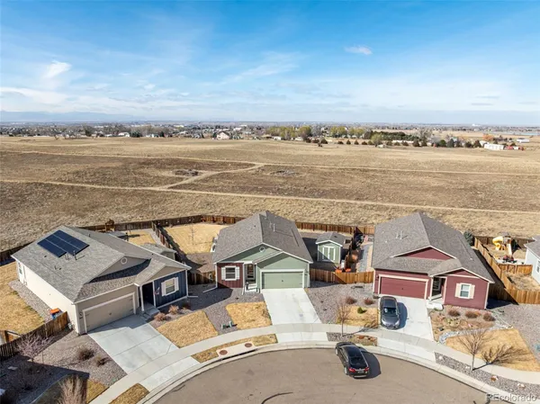 an aerial view of a house with roof deck