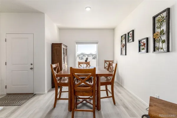 a dining room with furniture and window