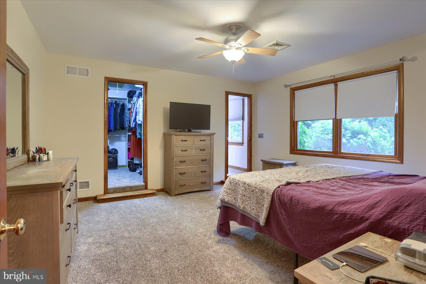 12 South Ridge Road Boiling Springs, PA 17007 - Photo 16 of 39 a spacious bedroom with a bed and a chandelier