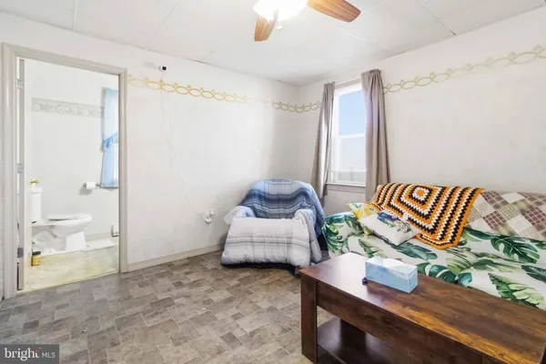 a bedroom with furniture and a window