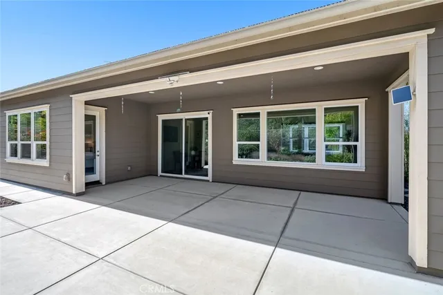 a kitchen that has a sink a stove top oven a refrigerator and a oven