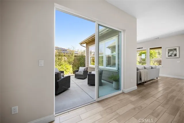 a view of a dining room with furniture window and wooden floor