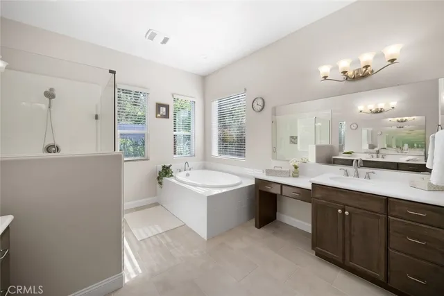 a bedroom with a bed and a lamp