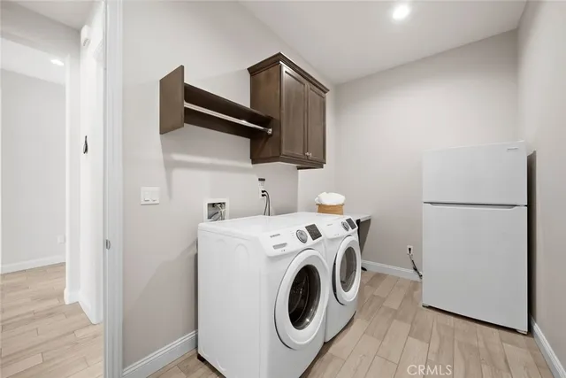 an aerial view of residential building with outdoor space and ocean view