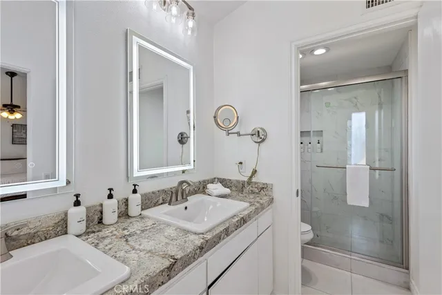 a bathroom with a shower and a toilet