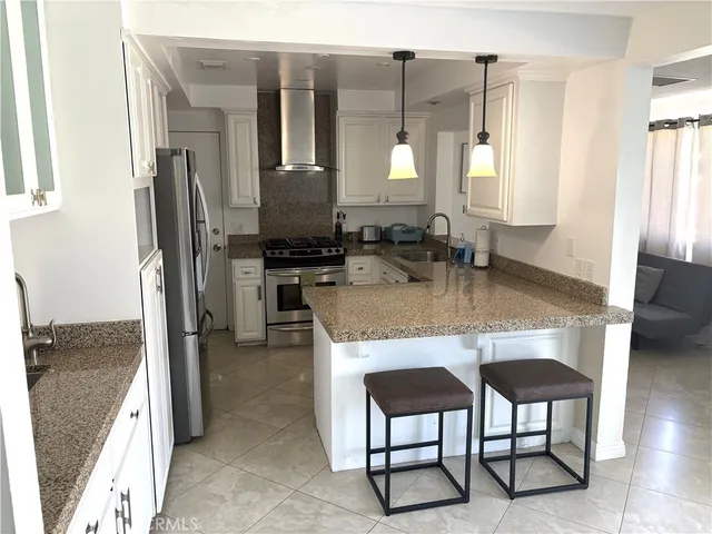 a bedroom with a large bed and a large window