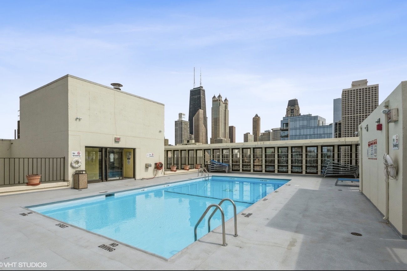 1 East Scott Street, Unit 2102 Chicago, IL 60610 - Photo 12 of 13 a view of a balcony with wooden floor
