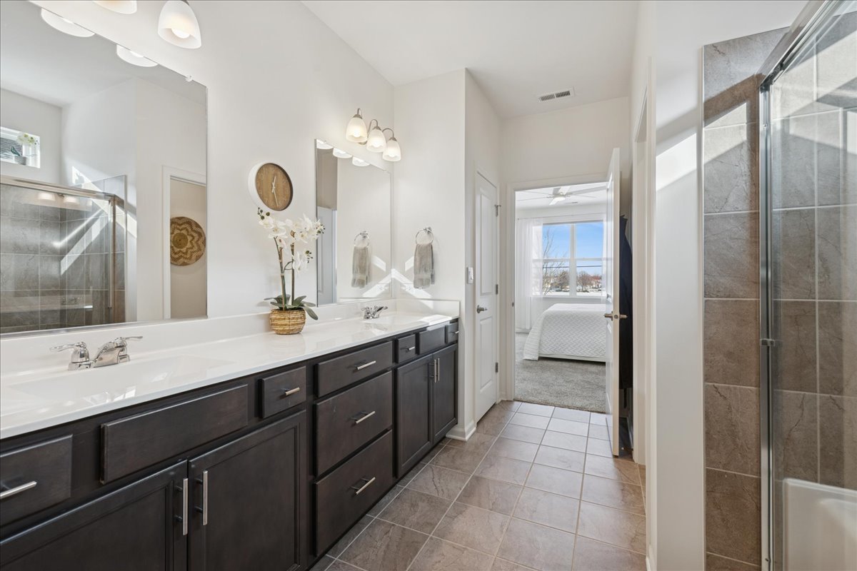 1639 Rochester Road Pingree Grove, IL 60140 - Photo 12 of 21 a spacious bathroom with a double vanity sink mirror and double